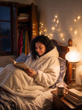 Hugsy Cream wearable blanket hoodie, reading in bed